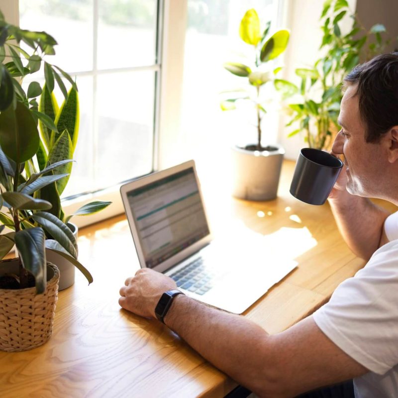 young-personal-development-coach-answering-the-client-by-email-by-a-laptop-1.jpg